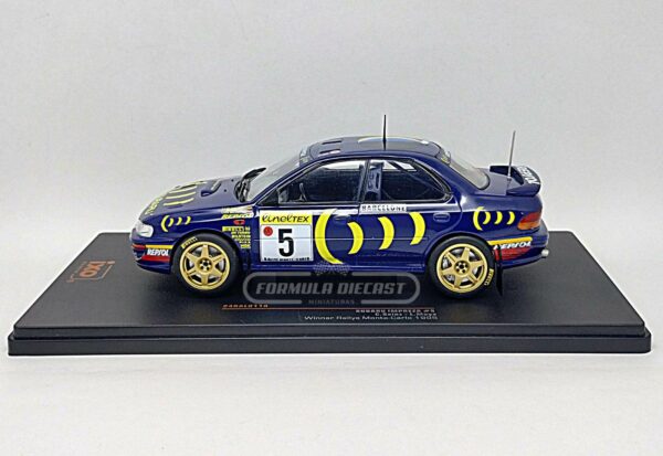 Miniatura de carro Subaru Impreza 555 #5 Sainz/Moya, Vencedor Rally Monte Carlo 1995, escala 1:24, marca IXO