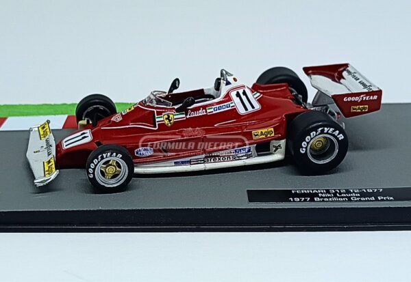 Miniatura de carro Ferrari 312T2 #11 pilotado por Niki Lauda no GP do Brasil, campeão mundial F1 1977, escala 1:43, marca Altaya