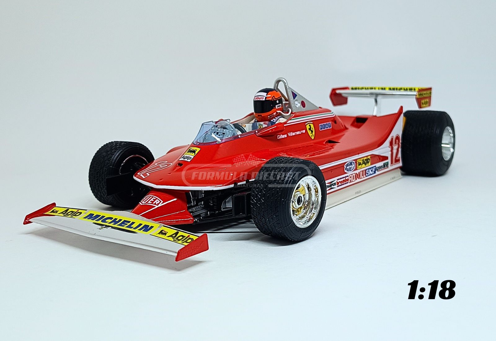 Miniatura de carro Ferrari 312T4 #12 Gilles Villeneuve, vencedor do GP de Long Beach-US, F1 1979, escala 1:18, marca Bburago