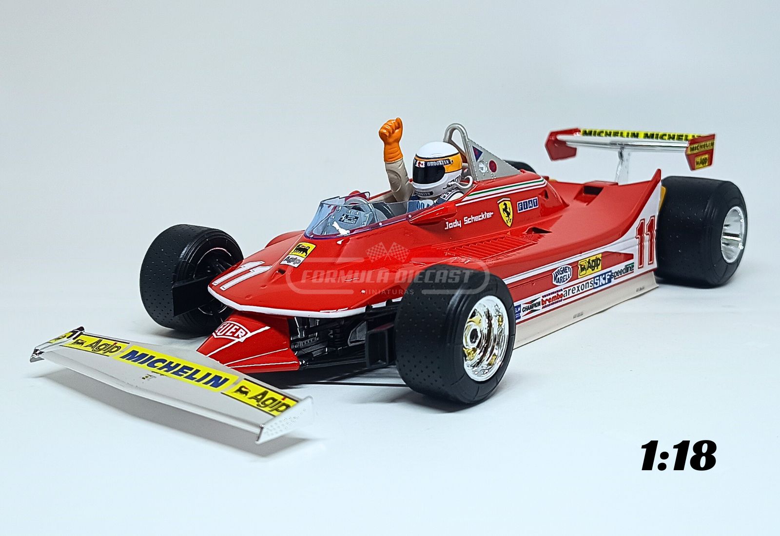 Miniatura de carro Ferrari 312T4 #11 J. Scheckter, vencedor GP Itália e campeão mundial F1 1979, escala 1:18, marca Bburago